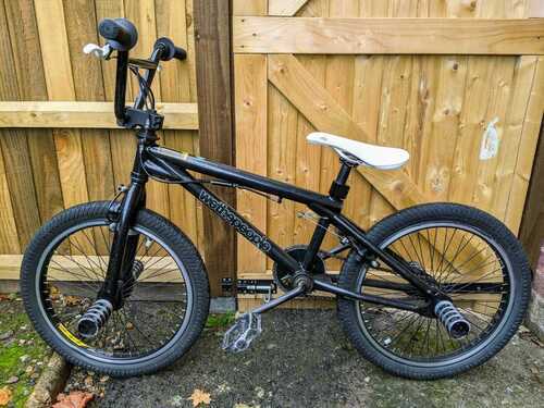 WheThePeople Black BMX bike with stunt pegs front and back. Good condition.